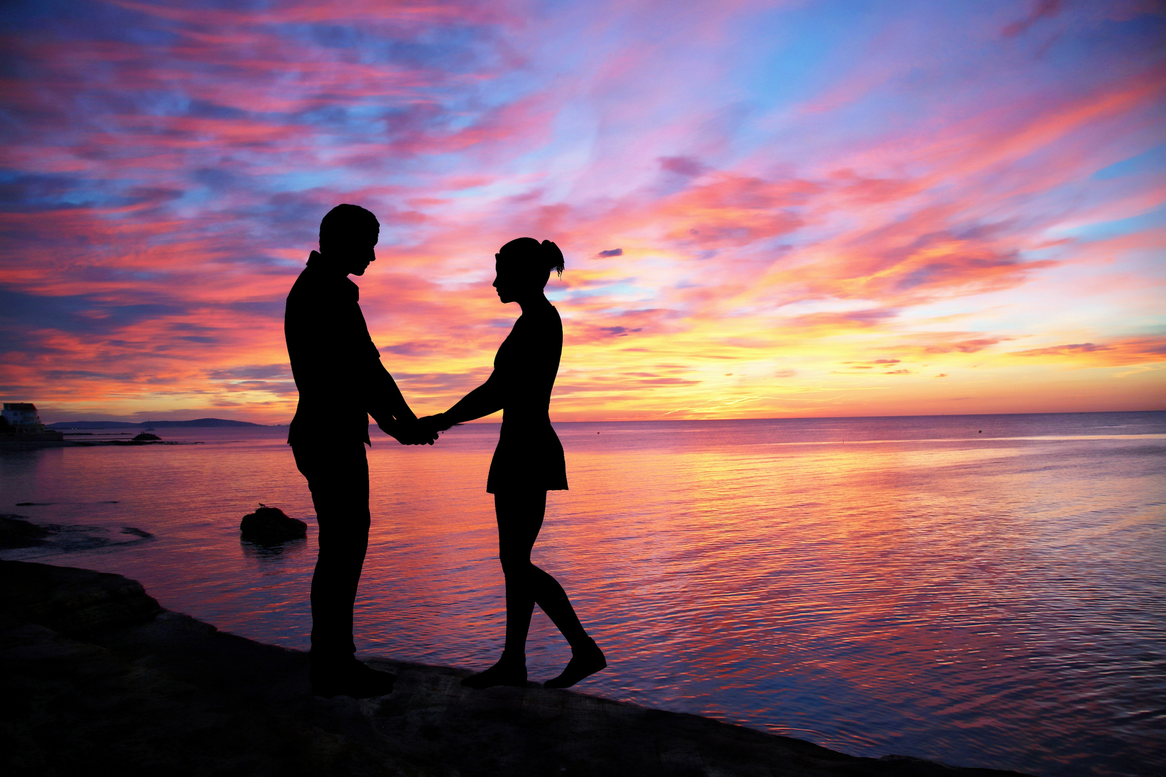 Silhouette of a Couple by the Beach